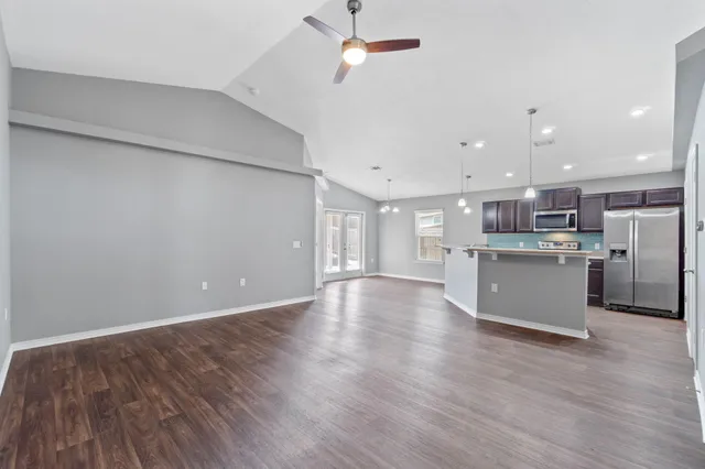 a view of kitchen with wooden floor and window