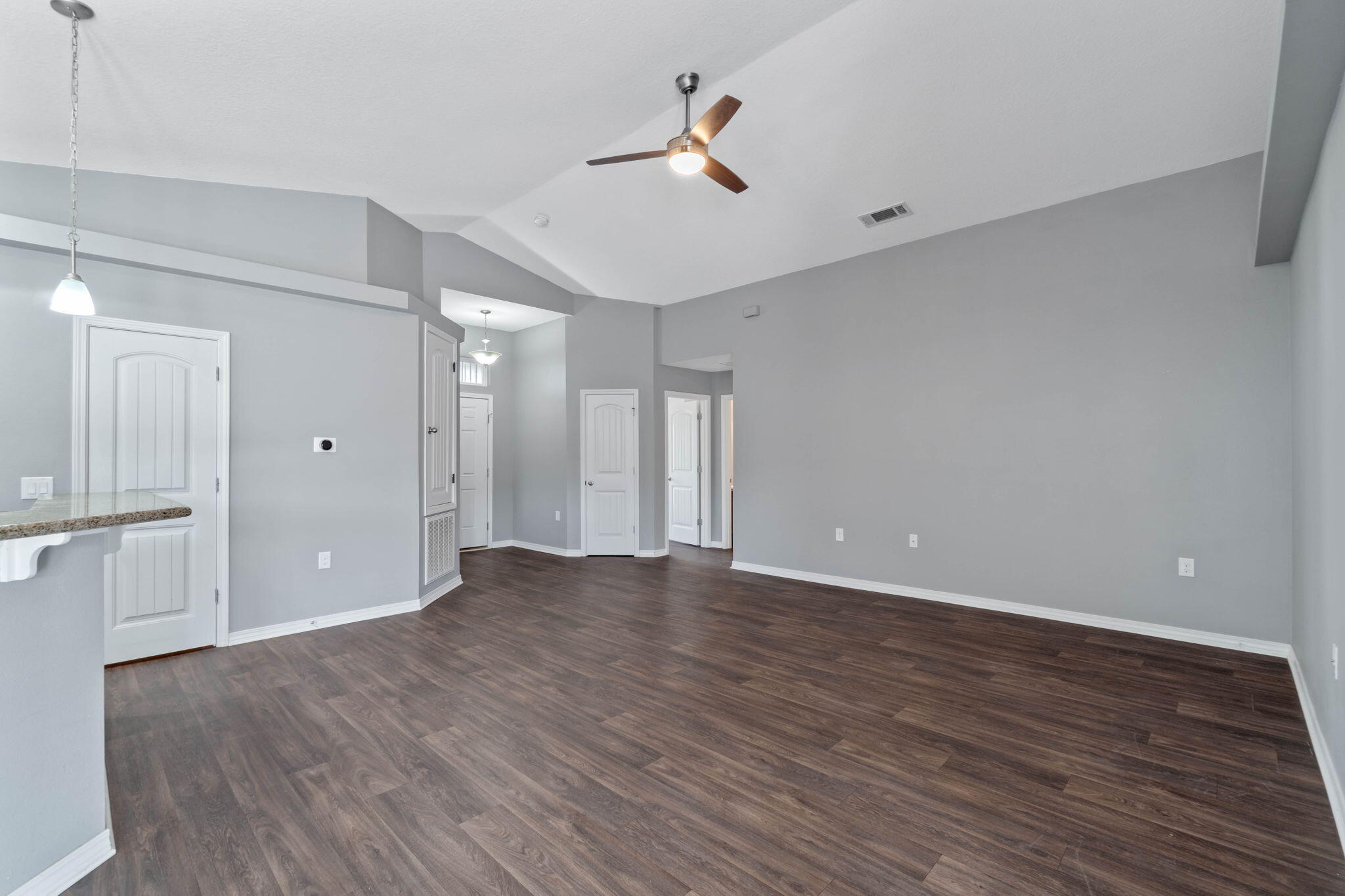 229 Croft Circle Crestview, FL 32536 - Photo 4 of 22 a view of an empty room with wooden floor
