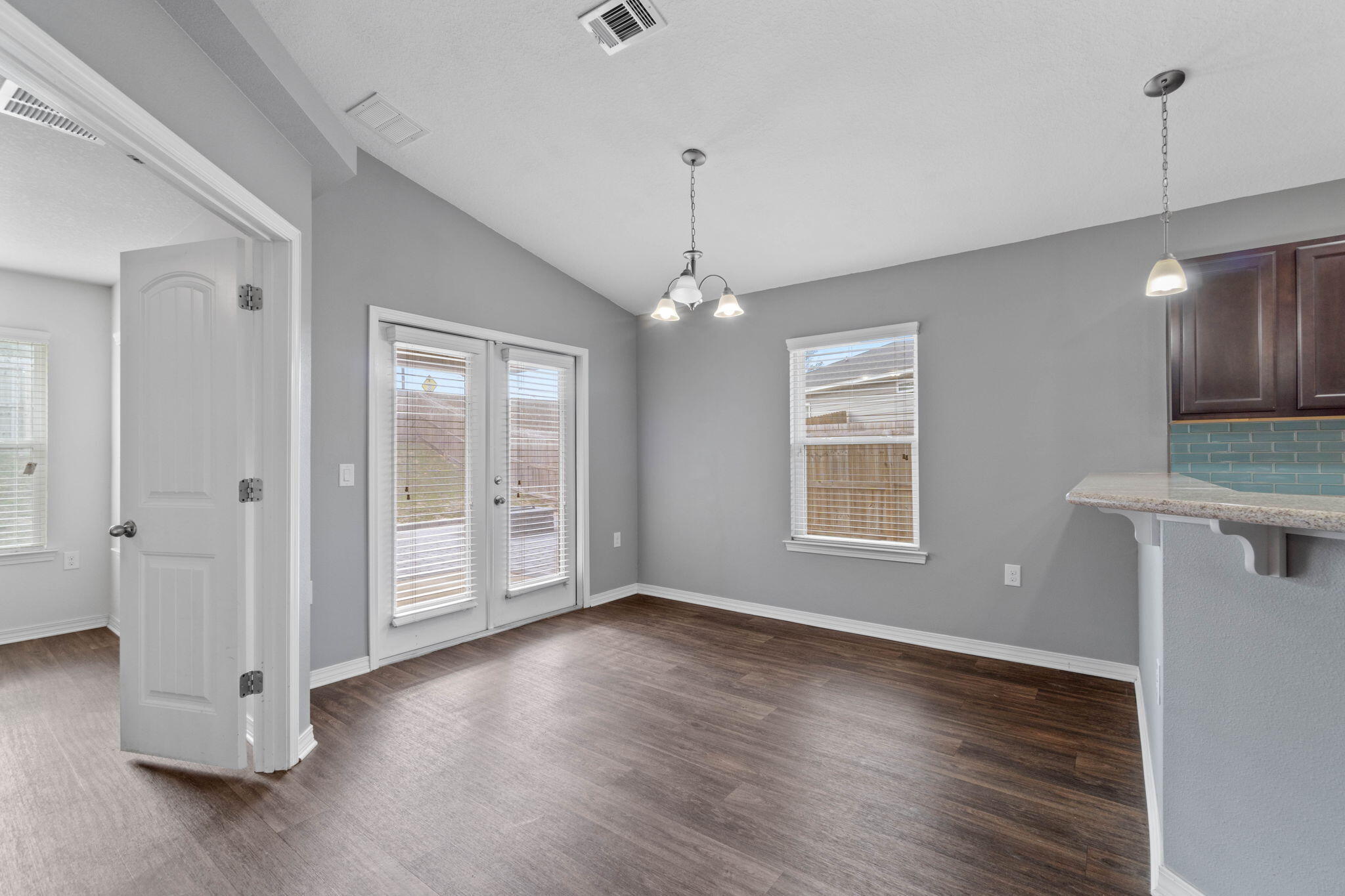 229 Croft Circle Crestview, FL 32536 - Photo 6 of 22 a view of an empty room with wooden floor and a window