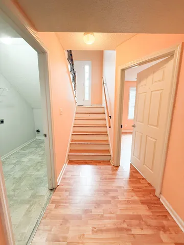 a view of entryway with wooden floor