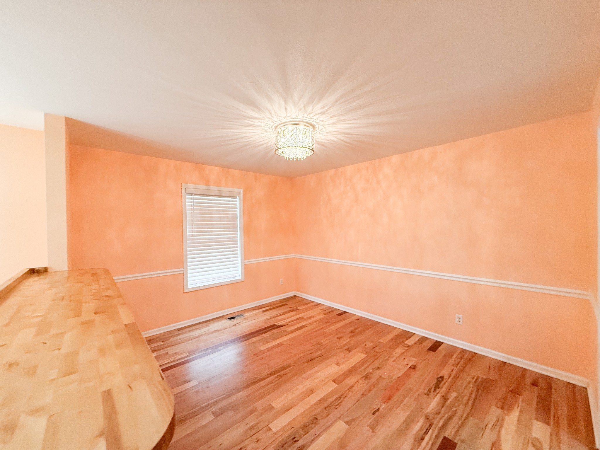 985 Silty Drive Clarksville, TN 37042 - Photo 7 of 19 a view of empty room with wooden floor and fan