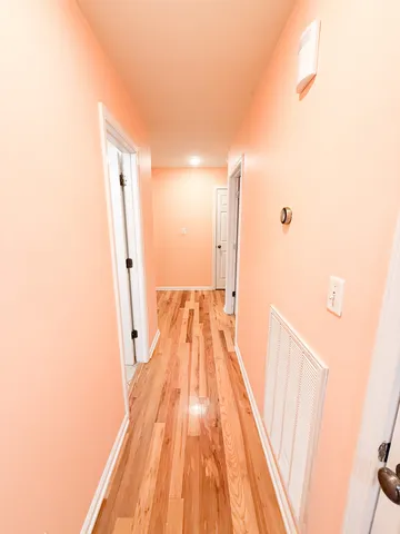 a view of wooden floor in a bathroom