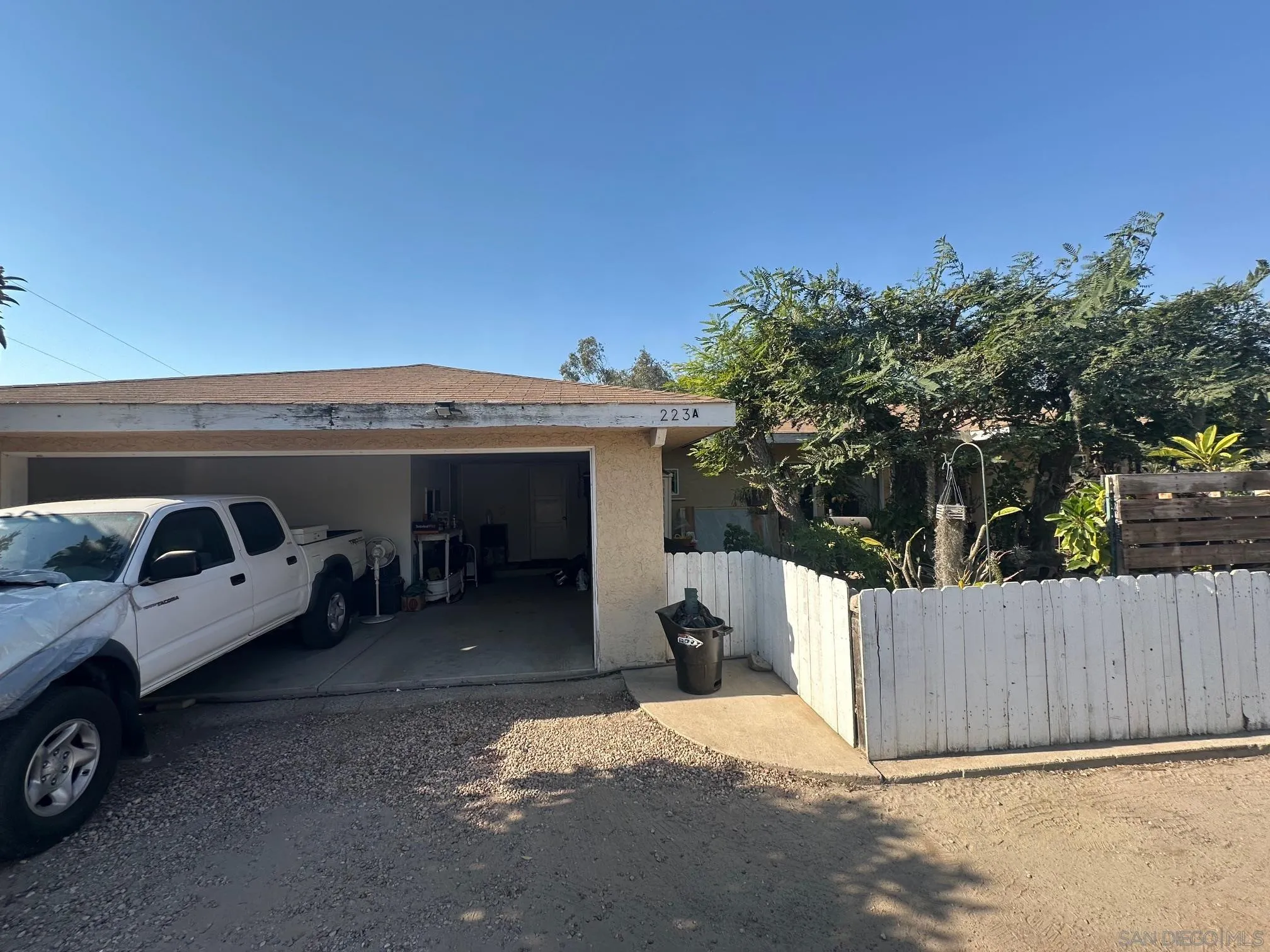 223 South Stage Coach Lane Fallbrook, CA 92028 - Photo 6 of 20 a view of a car in back of a house