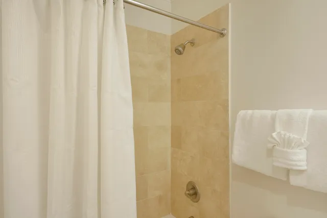 a view of a chairs and table in the balcony