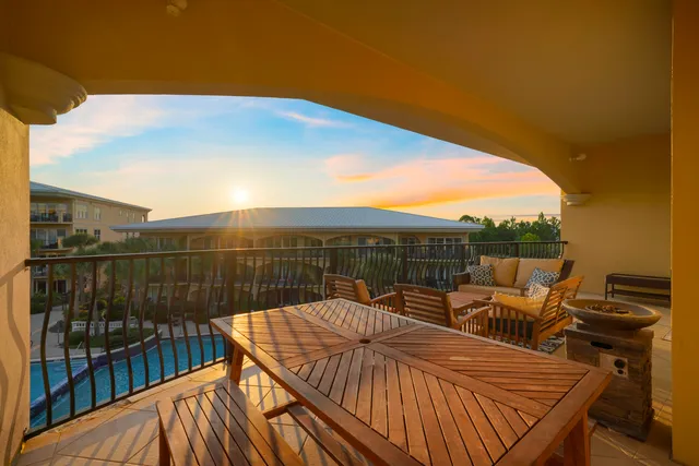 a view of swimming pool with outdoor seating and plants