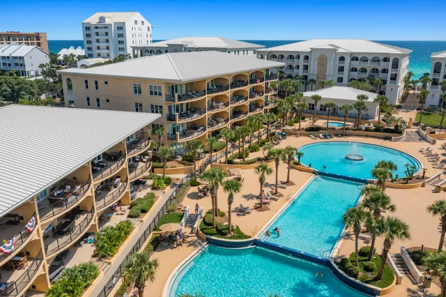 a view of a swimming pool with a yard