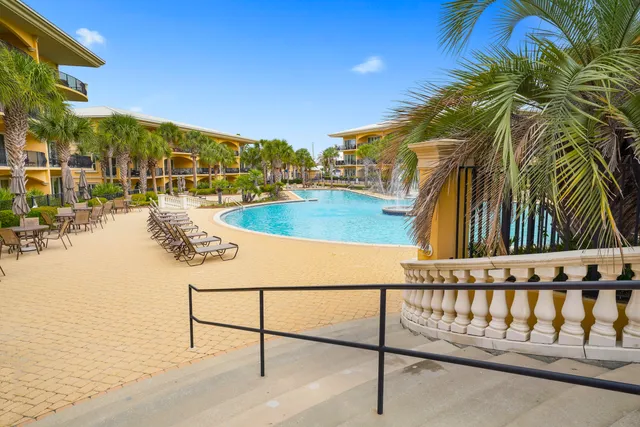 a view of swimming pool with an outdoor seating
