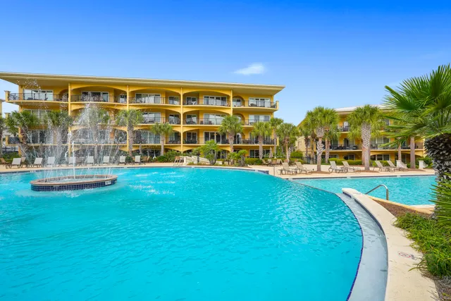 a view of a swimming pool with an outdoor seating