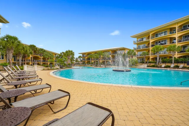 an aerial view of a house with a ocean view