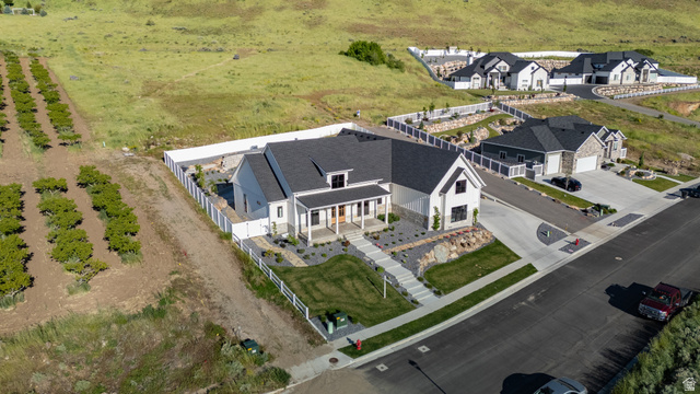 2013 South 100 West Perry, UT 84302 - Photo 42 of 49 Modern farmhouse-style residence featuring a prominent covered porch and gabled roofline