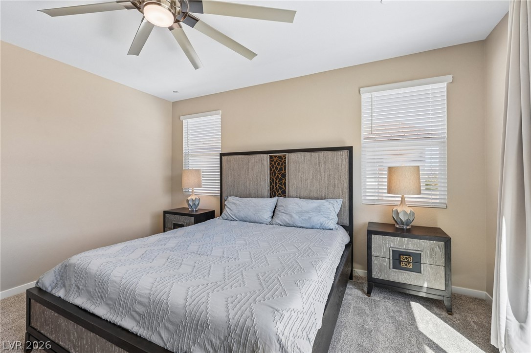 194 Viento Ridge Street Henderson, NV 89012 - Photo 30 of 72 Plentiful natural light streams across wall-to-wall carpeting in this comfortable bedroom space.