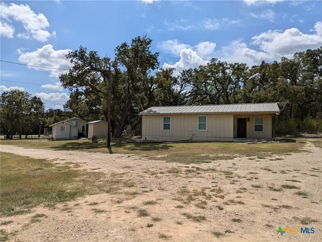 a house with trees in the background
