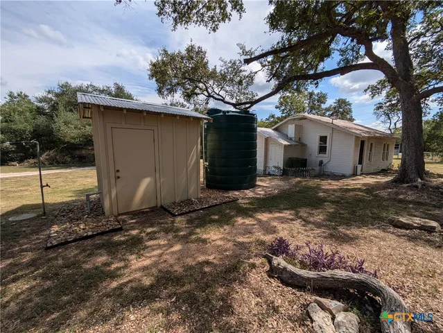 a view of a backyard of the house