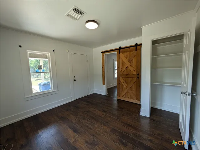 a view of livingroom with hardwood floor and window
