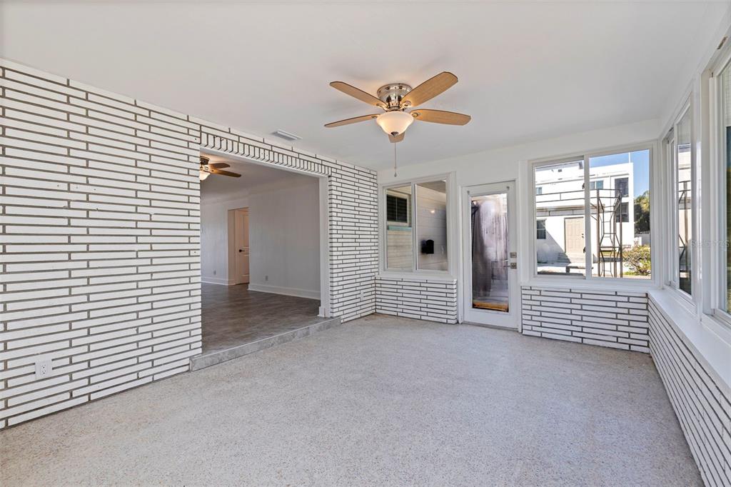 176 175th Avenue East Redington Shores, FL 33708 - Photo 13 of 37 a view of an empty room and window