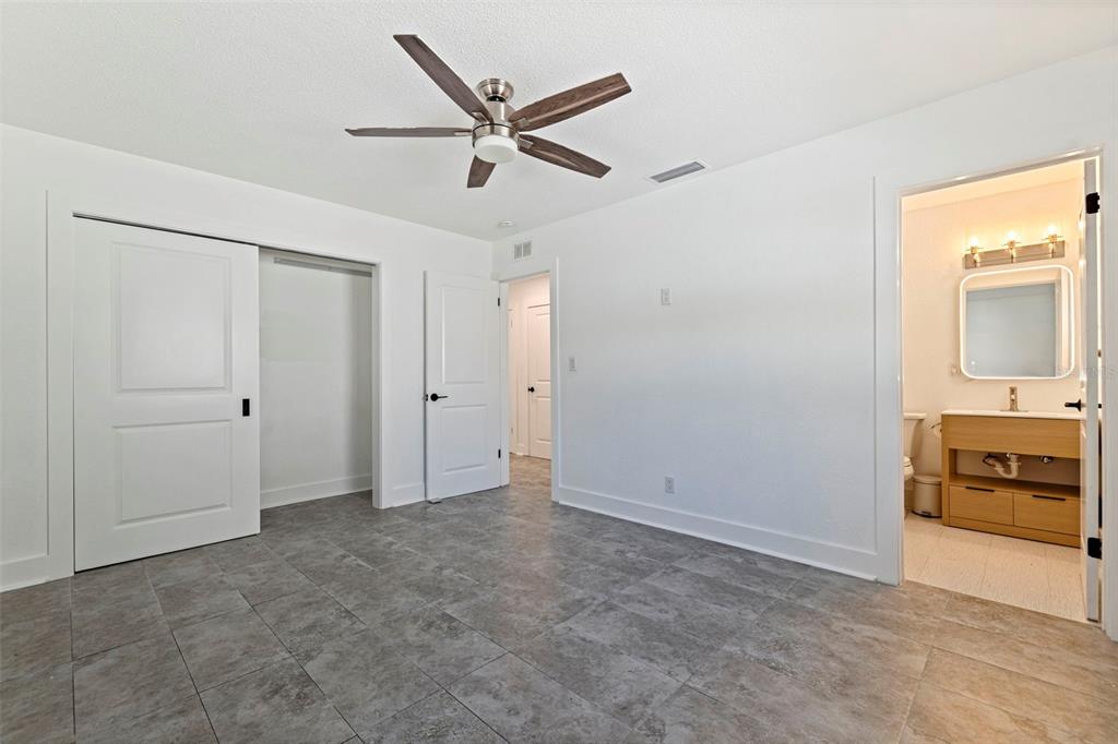 176 175th Avenue East Redington Shores, FL 33708 - Photo 17 of 37 a view of a livingroom with a ceiling fan and window