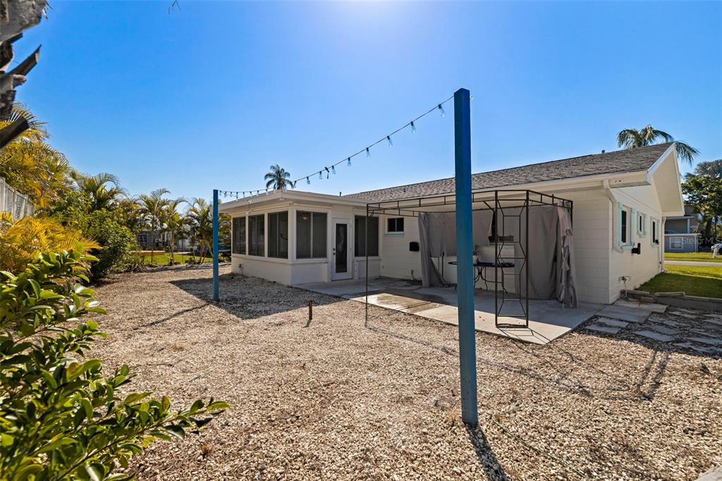 176 175th Avenue East Redington Shores, FL 33708 - Photo 25 of 37 a front view of a house with a yard