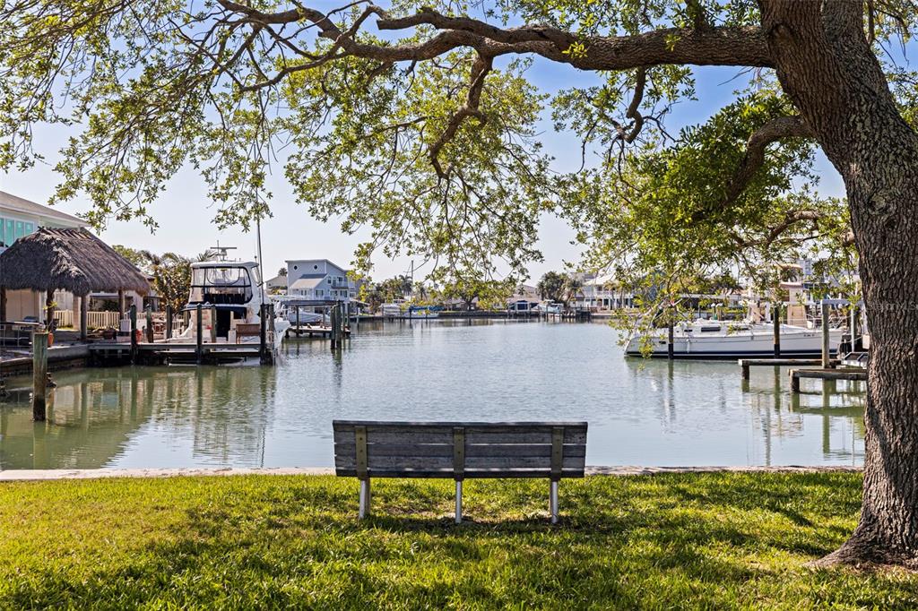 176 175th Avenue East Redington Shores, FL 33708 - Photo 30 of 37 a view of a lake with a house in the background