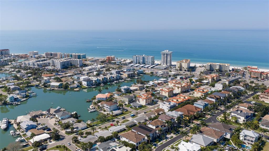 176 175th Avenue East Redington Shores, FL 33708 - Photo 33 of 37 an aerial view of a city with ocean view