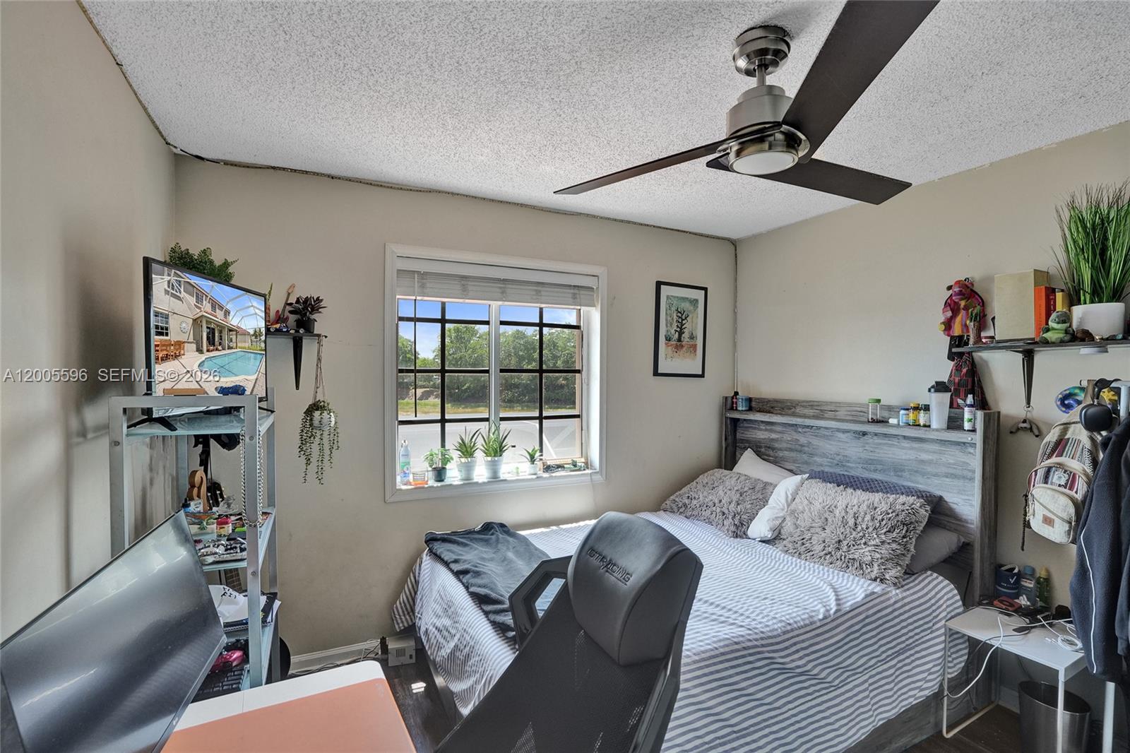 4281 Laurel Ridge Circle Weston, FL 33331 - Photo 62 of 80 a bedroom with furniture and a window