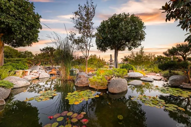 a living room with furniture and floor to ceiling windows