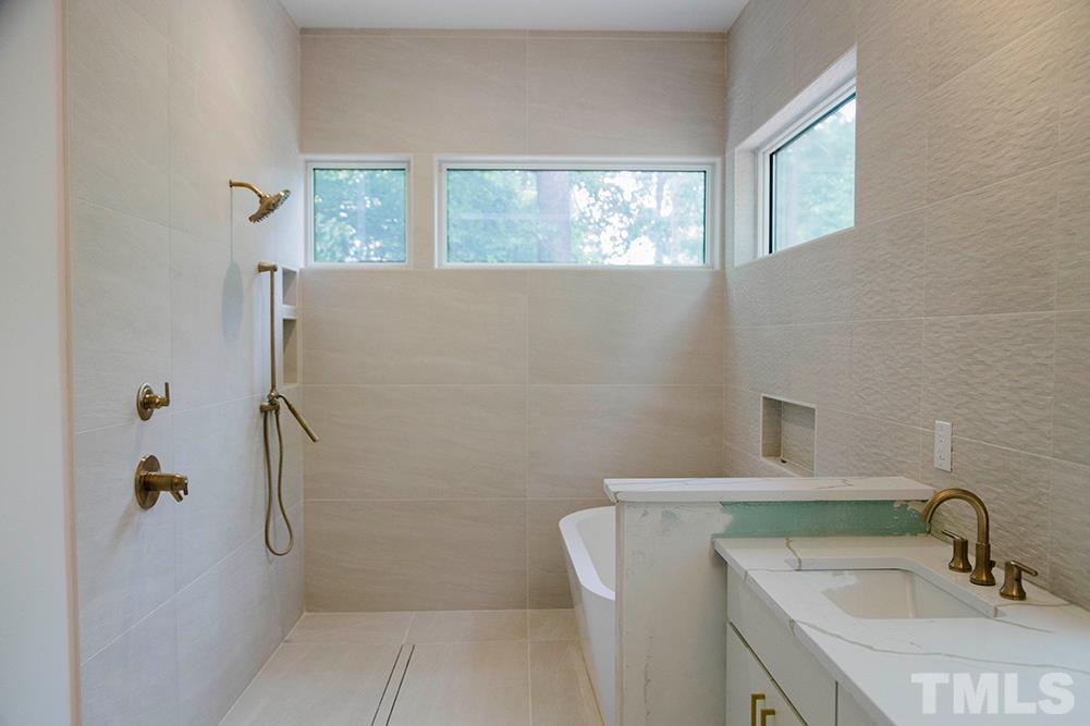 1601 Nottingham Road Raleigh, NC 27607 - Photo 9 of 14 a bathroom with a sink a toilet and shower