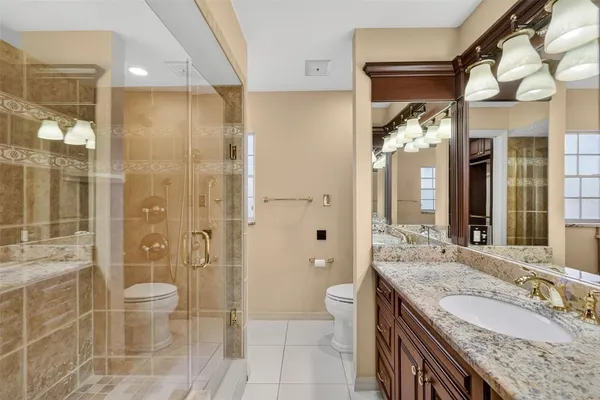 a view of kitchen with stainless steel appliances granite countertop window