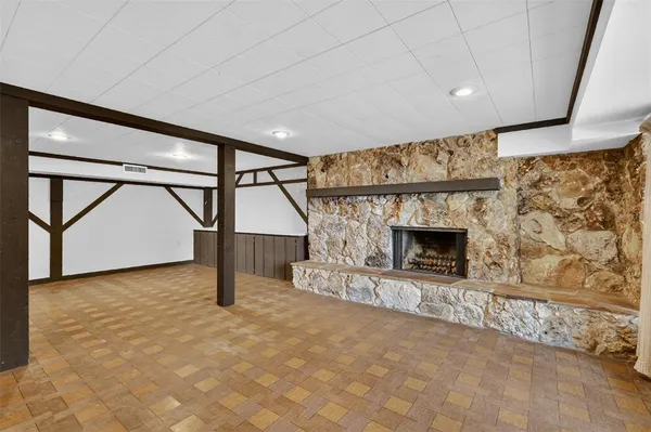 a view of house with outdoor space and sitting area