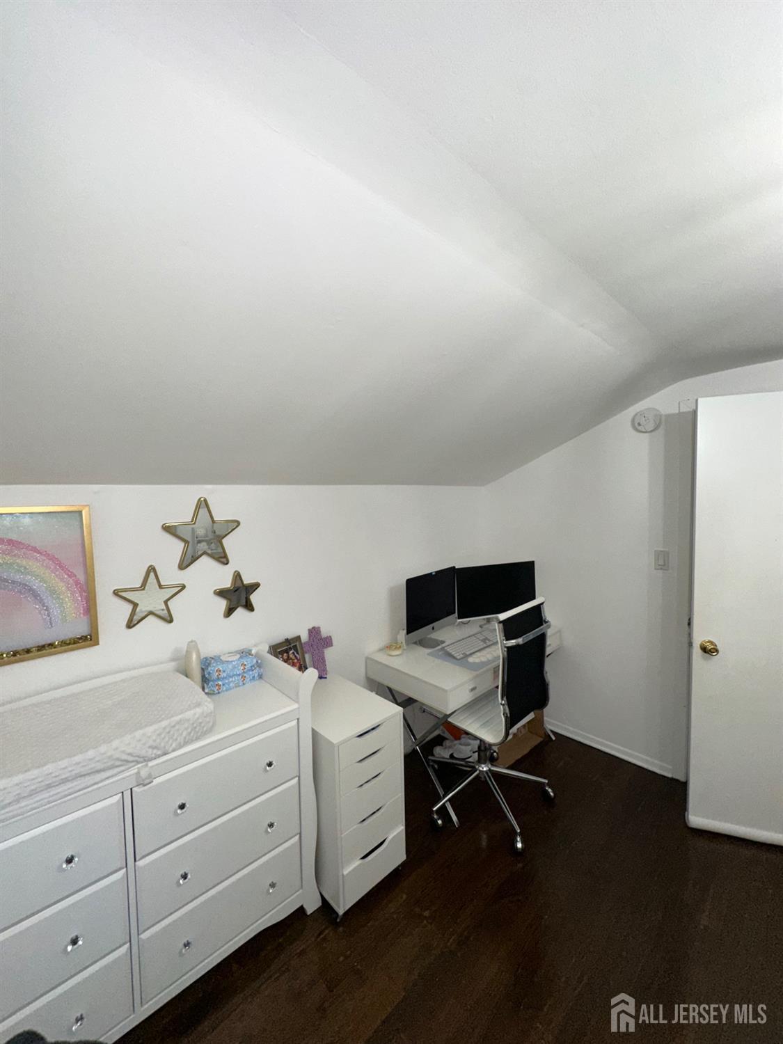 1019 Main Street Fords, NJ 08863 - Photo 17 of 20 a bedroom with a bed and cabinets