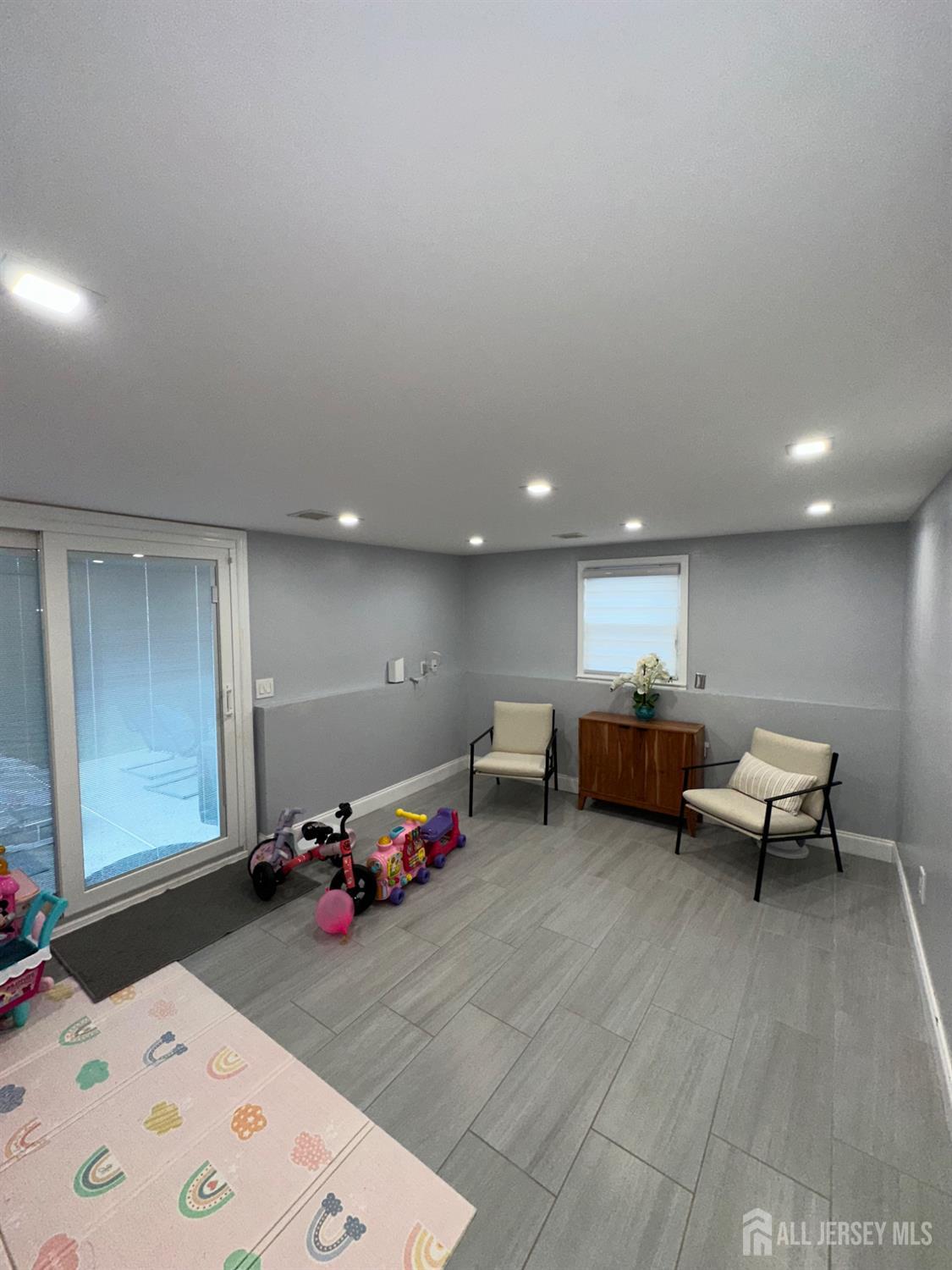 1019 Main Street Fords, NJ 08863 - Photo 18 of 20 a living room with furniture and a wooden floor