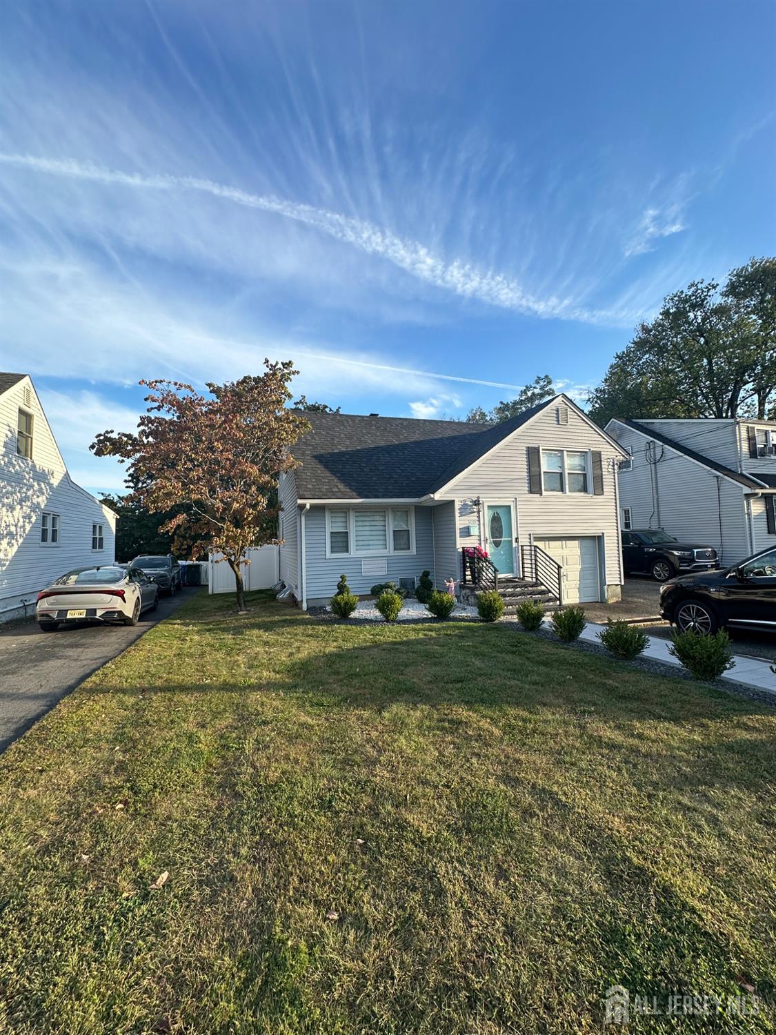 1019 Main Street Fords, NJ 08863 - Photo 2 of 20 a view of a big house with a big yard and potted plants