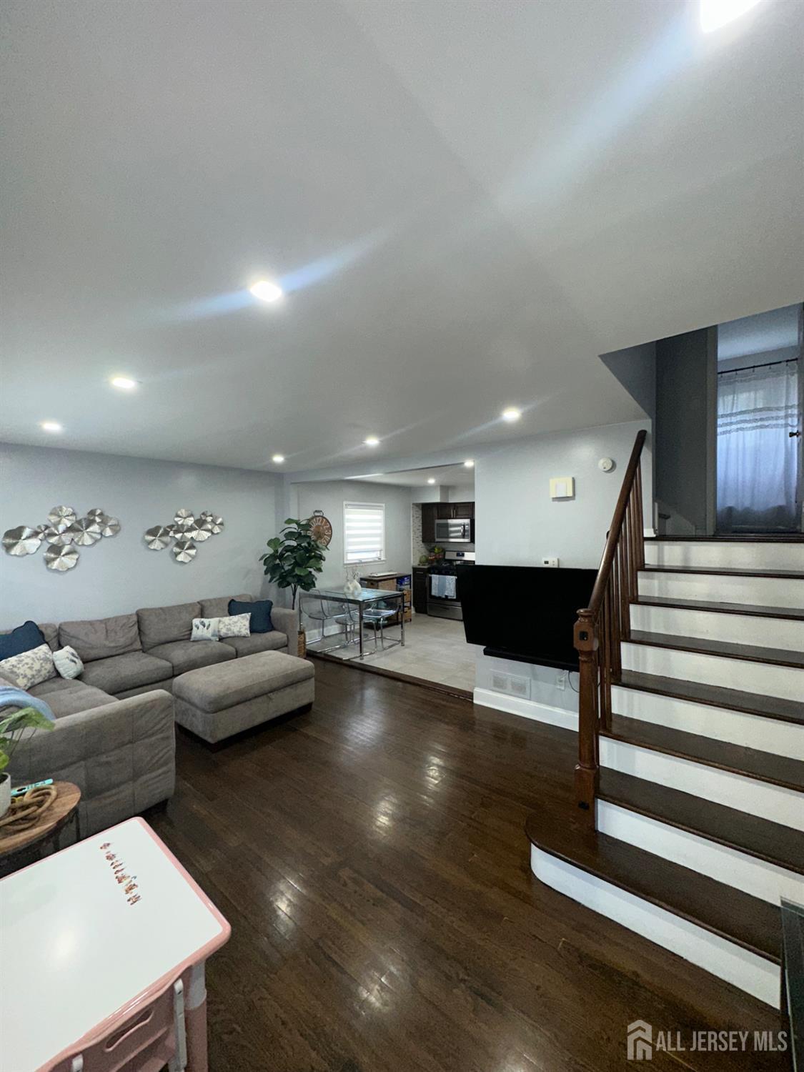 1019 Main Street Fords, NJ 08863 - Photo 5 of 20 a living room with furniture and a view of kitchen