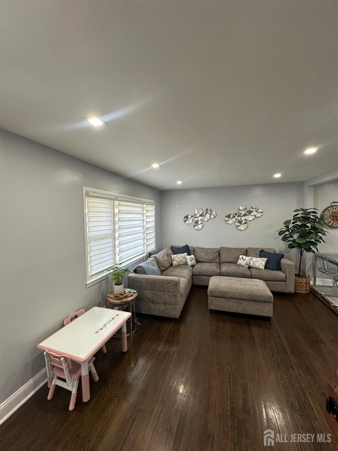 1019 Main Street Fords, NJ 08863 - Photo 6 of 20 a living room with furniture a wooden floor and a large window