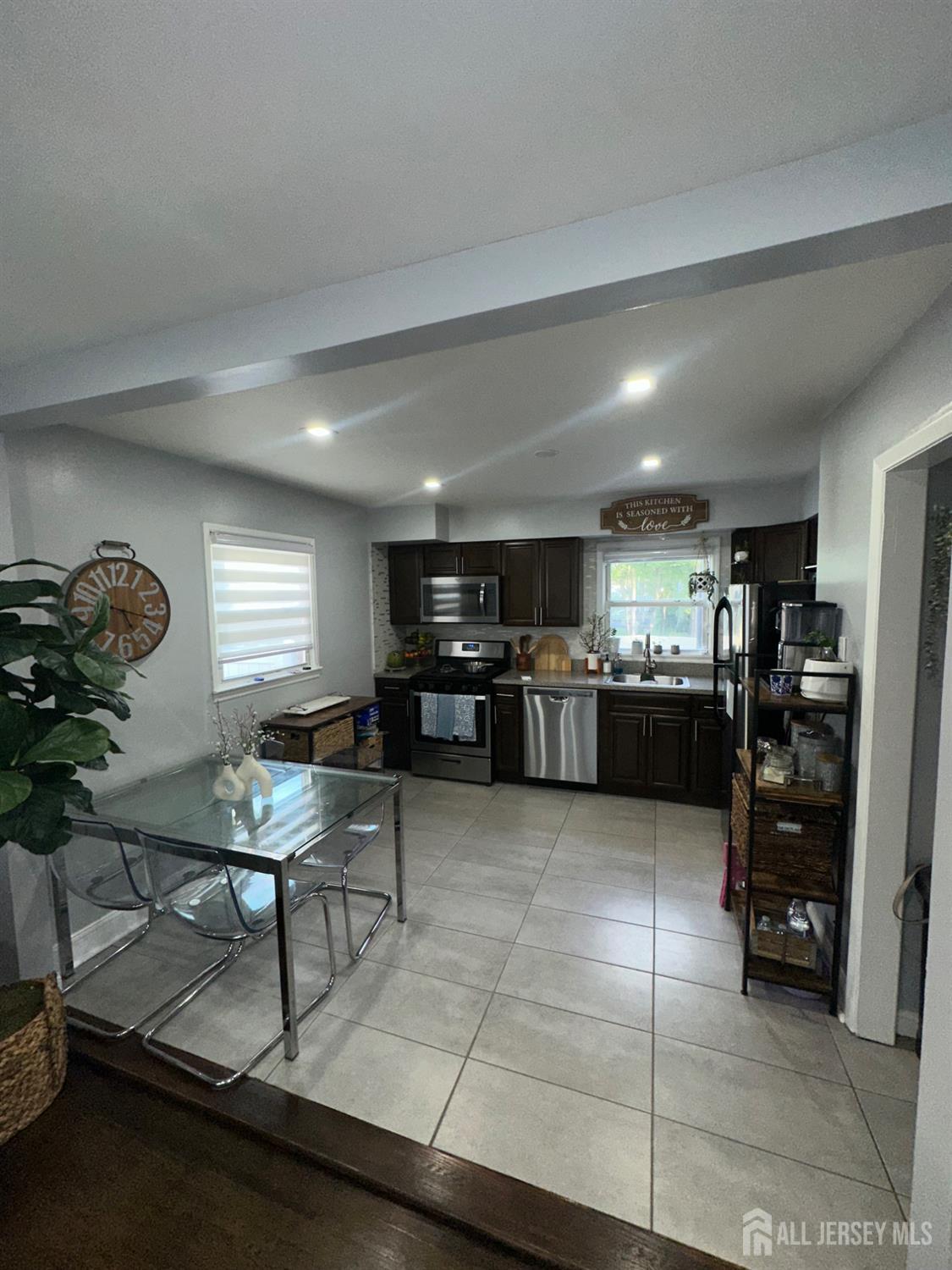 1019 Main Street Fords, NJ 08863 - Photo 9 of 20 a room with furniture and kitchen view