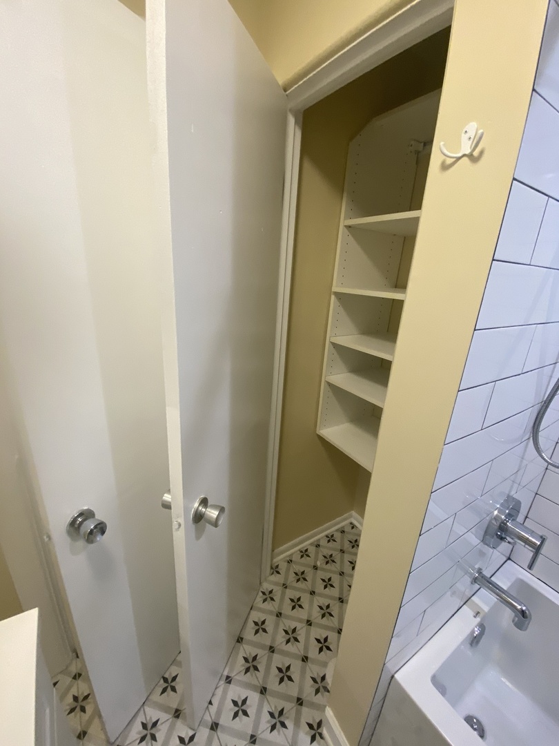 501 Sheridan Road, Unit A1 Evanston, IL 60202 - Photo 30 of 30 a bathroom with a sink and a shower