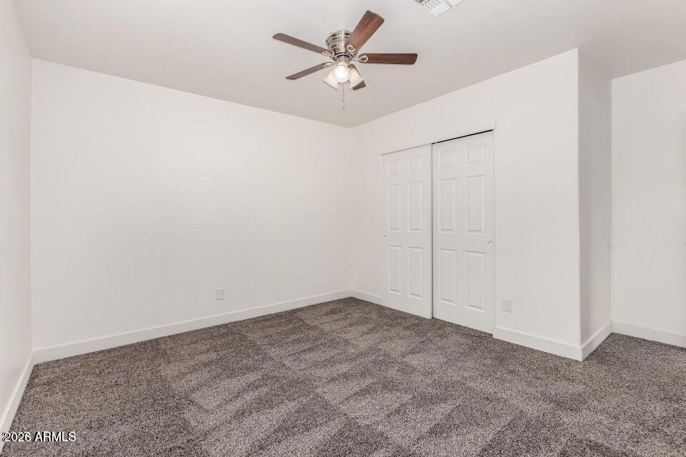 2828 East Chipman Road Phoenix, AZ 85040 - Photo 21 of 26 an empty room with a fan