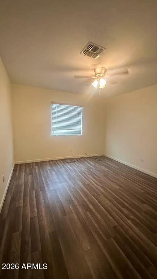 2828 East Chipman Road Phoenix, AZ 85040 - Photo 23 of 26 a view of empty room with wooden floor