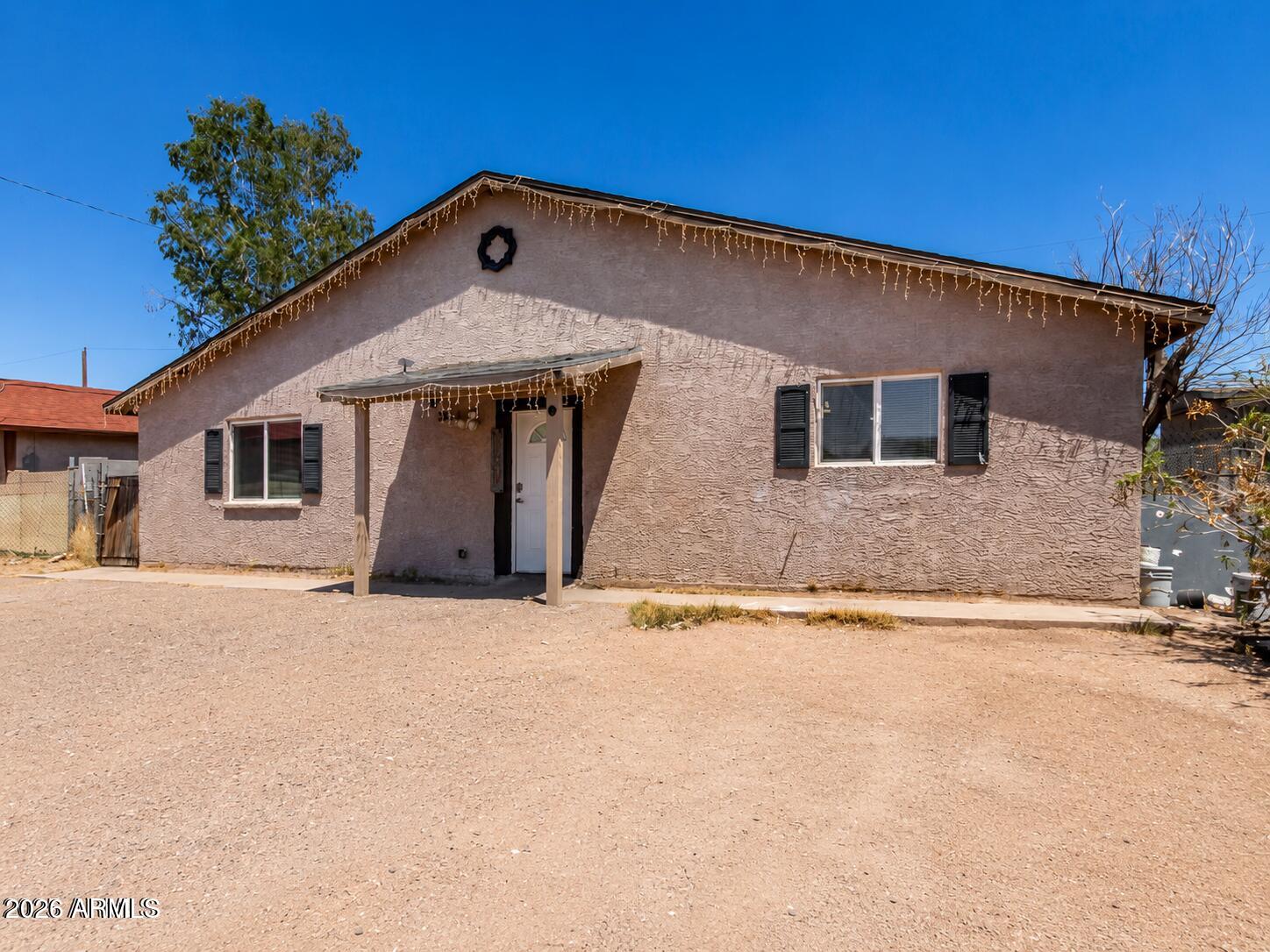 2828 East Chipman Road Phoenix, AZ 85040 - Photo 3 of 26 a front view of a house with a yard