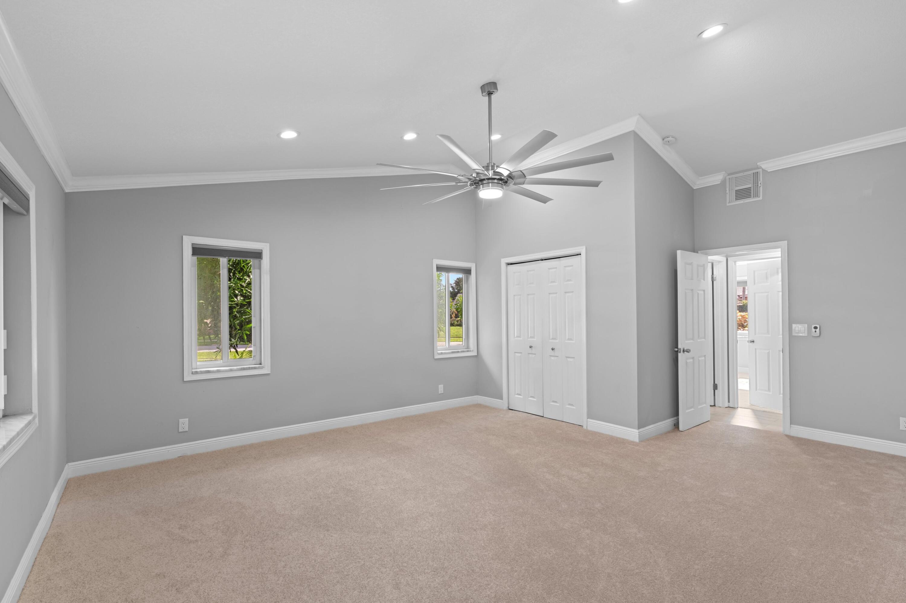 1431 Rudder Cove Wellington, FL 33414 - Photo 11 of 22 an empty room with fan and windows