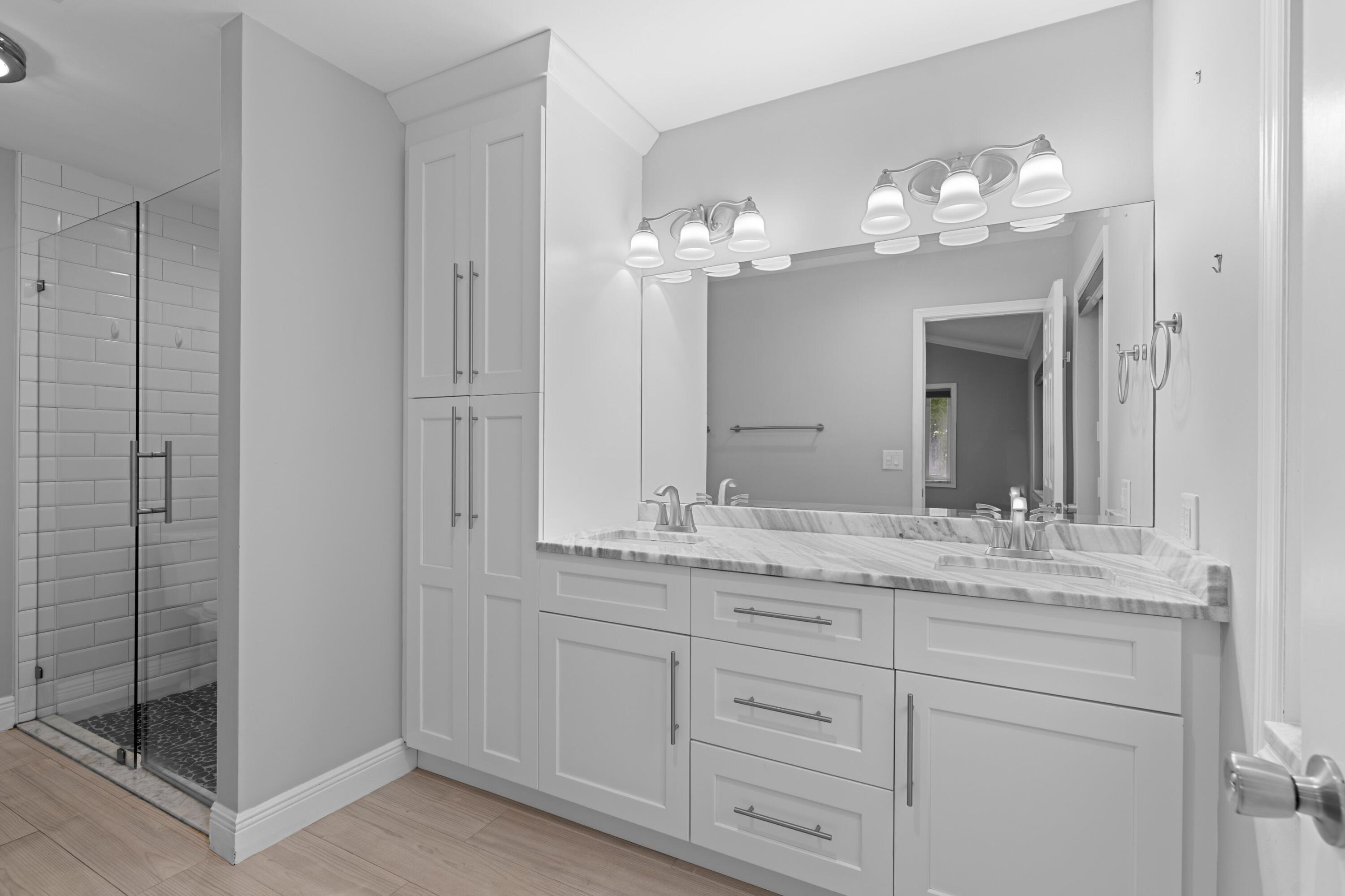 1431 Rudder Cove Wellington, FL 33414 - Photo 12 of 22 a bathroom with a sink and a mirror