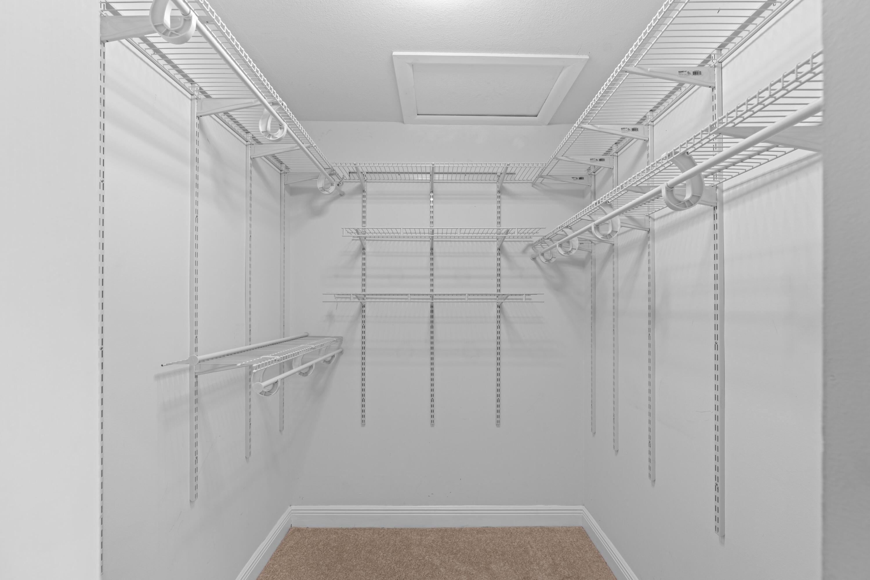 1431 Rudder Cove Wellington, FL 33414 - Photo 13 of 22 a view of a room with racks on the wall