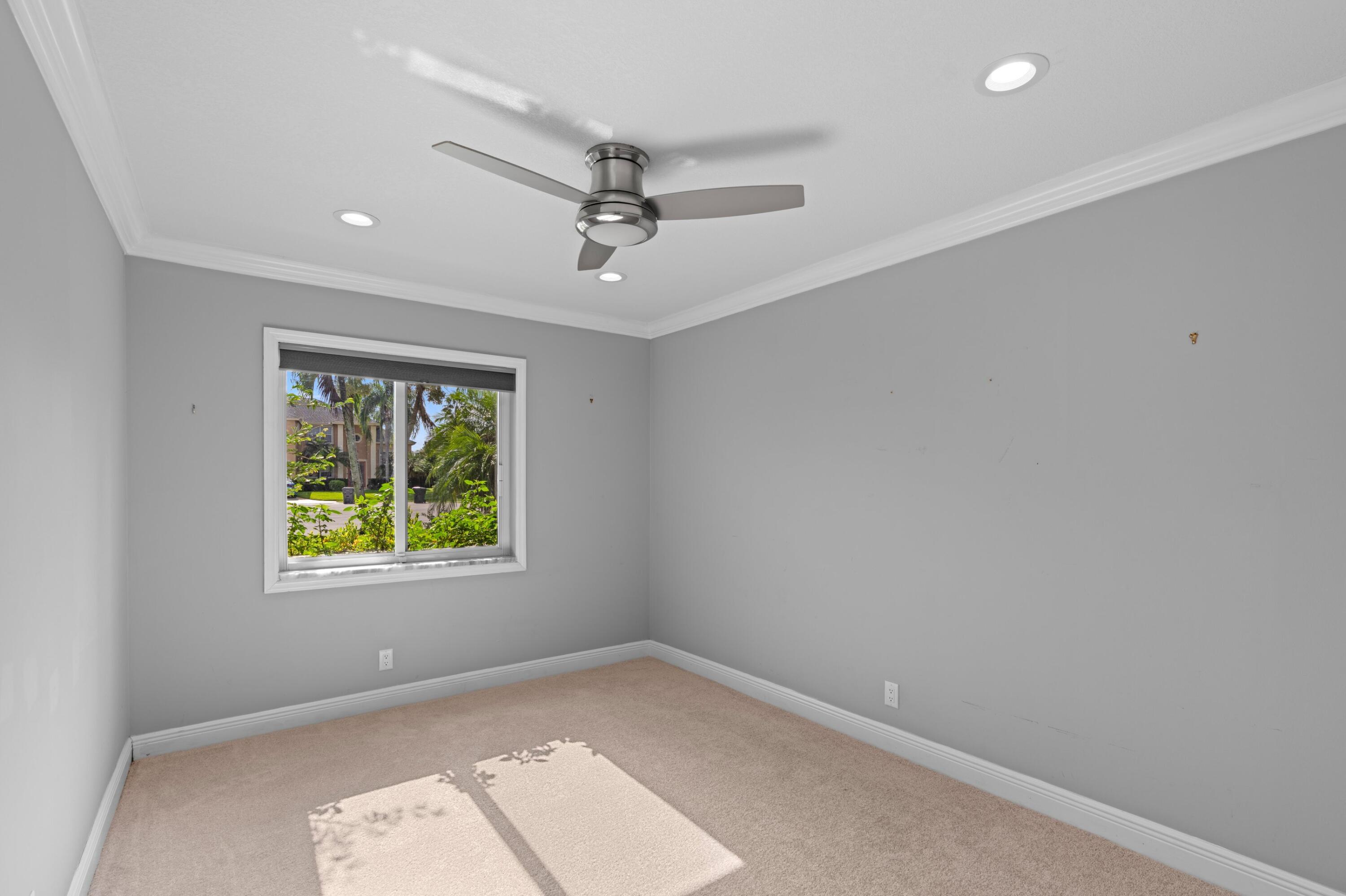 1431 Rudder Cove Wellington, FL 33414 - Photo 16 of 22 an empty room with windows and closet