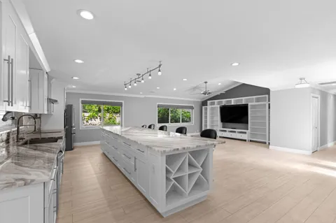 a large room with kitchen view