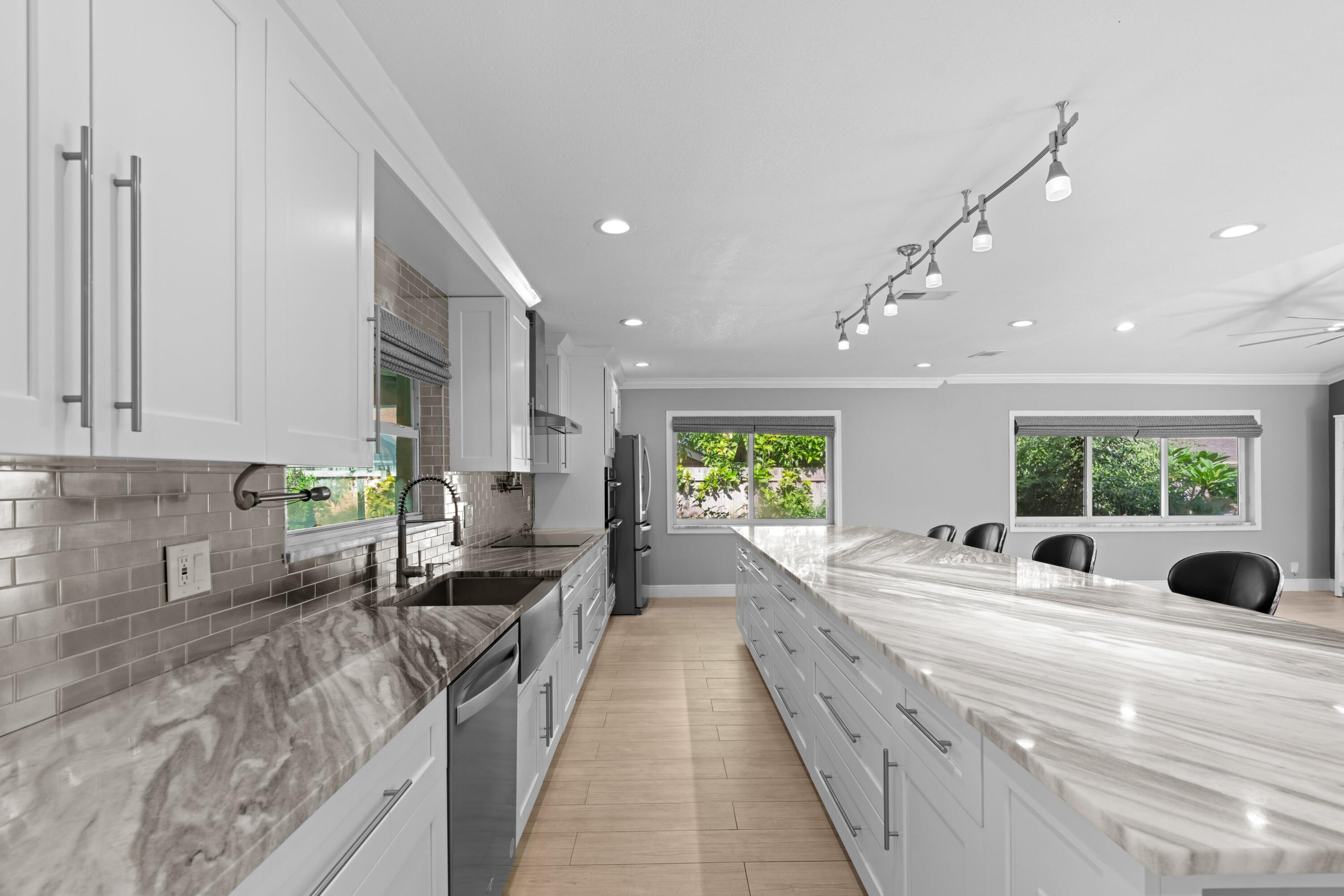 1431 Rudder Cove Wellington, FL 33414 - Photo 6 of 22 a large kitchen with stainless steel appliances lots of counter top space