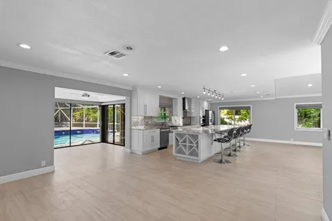an entryway and livingroom with furniture