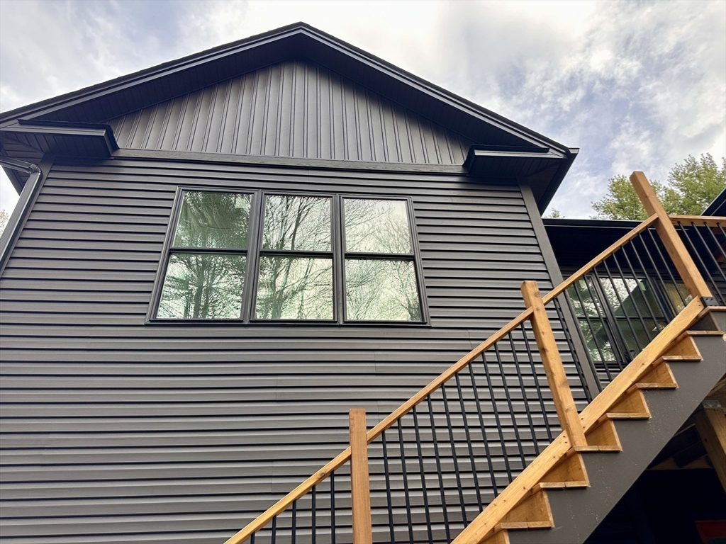 20 Merrifield Road North Bernardston, MA 01337 - Photo 10 of 17 a front view of a house with a balcony