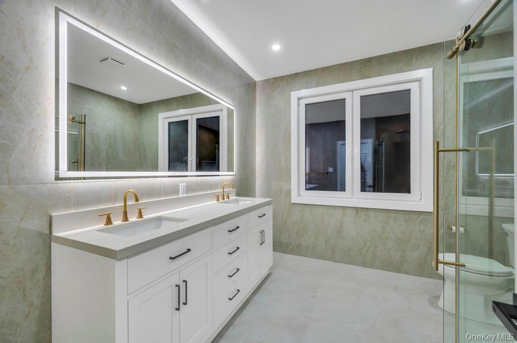472 Farm Ranch Road East Bethpage, NY 11714 - Photo 23 of 26 a bathroom with a sink and a mirror