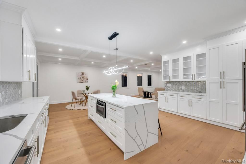 472 Farm Ranch Road East Bethpage, NY 11714 - Photo 4 of 26 a large white kitchen with a stove top oven