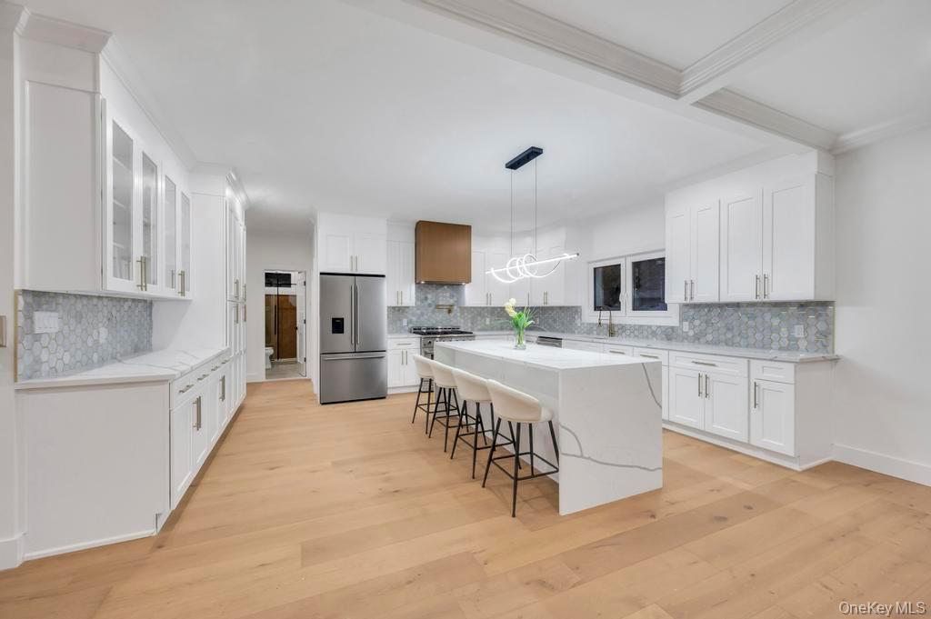 472 Farm Ranch Road East Bethpage, NY 11714 - Photo 7 of 26 a large kitchen with cabinets and wooden floor