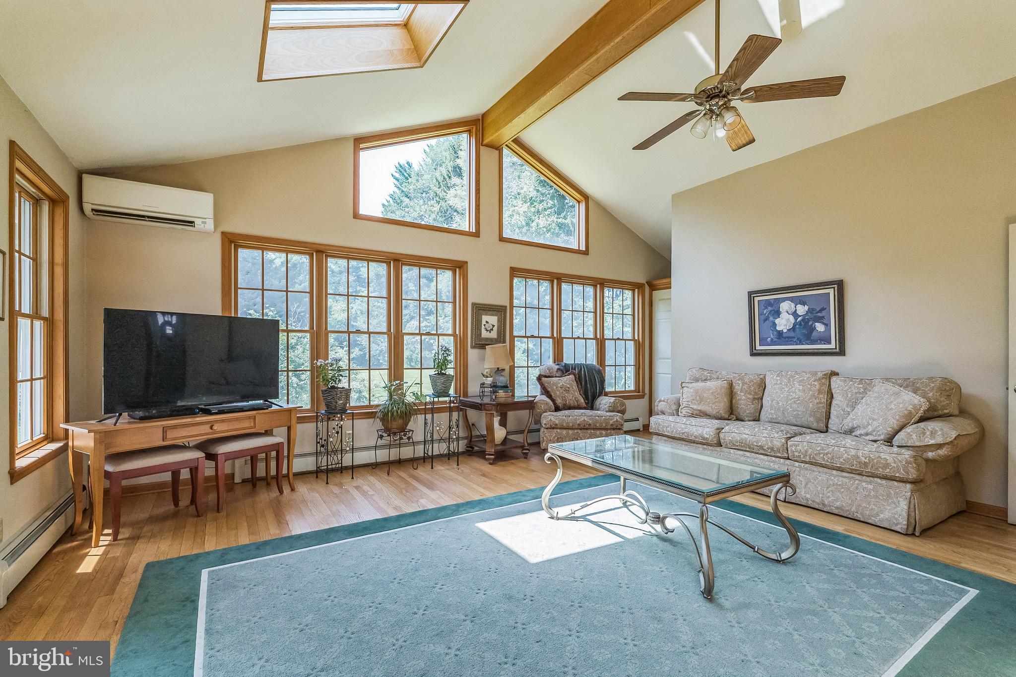 31 Rabbit Run Road Rose Valley, PA 19086 - Photo 12 of 35 a living room with furniture and a flat screen tv